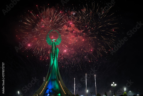 Spectacular colorful fireworks illuminating the Humo Bird Stella in Yangi Uzbekistan, Tashkent, Uzbekistan, at night. Dramatic festive scene featuring the iconic national symbol against a vibrant illu
