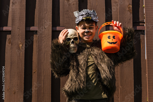 Obraz na plátně Adorable boy dressed in a monster costume ready for Halloween fun and trick or t