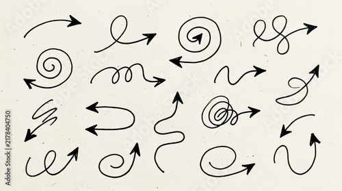 Hand-drawn Arrow Collection: Swirls, Curves, and Lines on Textured Background