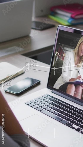 Laptop showing animation of data analysis graphics during business meeting call