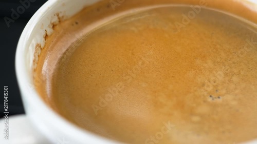 Espresso crema coffee  background Close-up macro Golden brown coffee foam with bubbles	