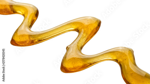 Golden honey drizzle isolated on transparent background wavy syrup