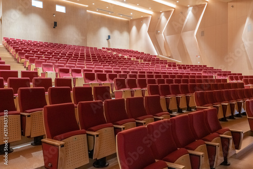 Modern Theater Auditorium with Red Velvet Seats and Contemporary Architecture