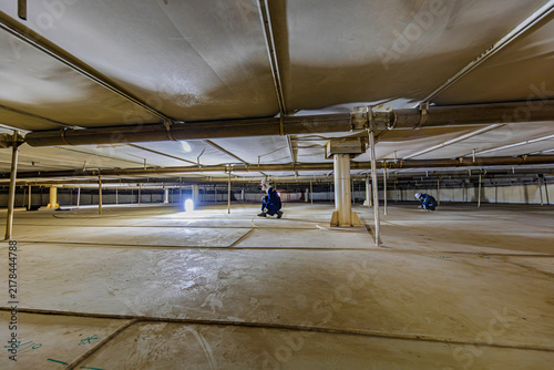 Male worker into the tank carbon chemical oil interface area confined