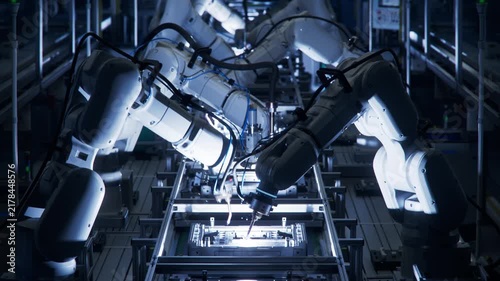 3D Animation: Lights out Assembly Line with Autonomous Industrial Robot Arms. Automated Production Line with Robotic Arms on Dark Factory. Welding and Manufacturing Automation.