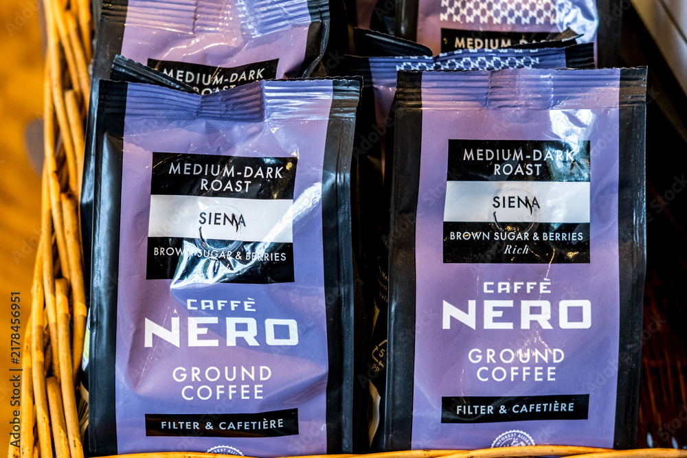 Obraz premium September 02 2026, Close-Up Of A Product Display Featuring Bags Of Caffe Nero Medium-Dark Roast Siena Ground Coffee