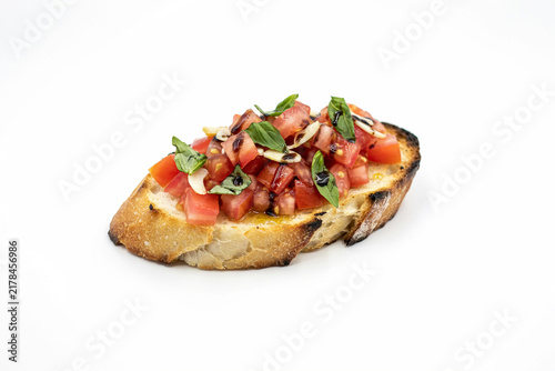Fresh tomato bruschetta toast with herbs and olive oil
