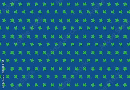 A green clover leaf on a Dodger Blue color background. It is a symbol of good luck.