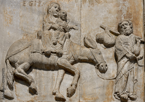 Medieval stone relief depicting Mary, Joseph and baby Jesus in Verona, Italy