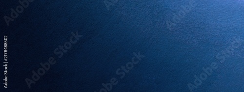 Dark blue watercolor texture background with navy gradient and rough plaster surface, abstract art backdrop