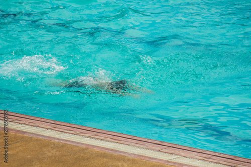asia Children competing in breaststroke swimming