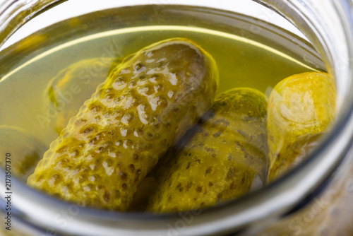Close up shot of pickles in a jar.