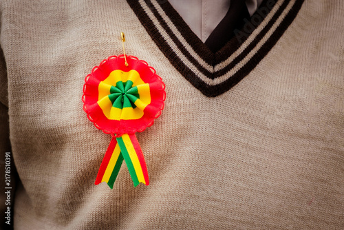 Bolivian cockade on a boy's school uniform - concept of education