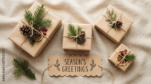 Festive gift boxes with natural pine cone and evergreen branch decorations on a light background