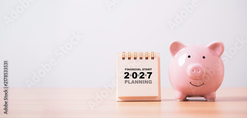 Financial planning 2027 concept with piggy bank and calendar representing savings goals, budgeting and money management to prepare personal finances for a secure and successful financial year ahead.