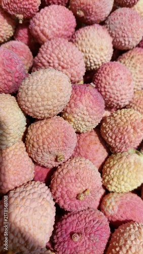 Картината върху платно Abundant Pile of Fresh Ripe Lychee Fruits with Textured Skins