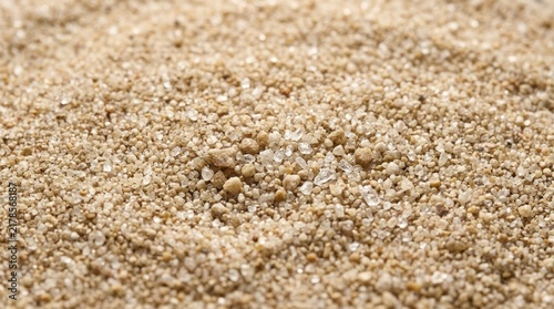 Close up of beach sand texture with fine grains and tiny pebbles