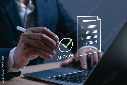 Cuadro en lienzo Business document approval concept with a professional signing paperwork beside