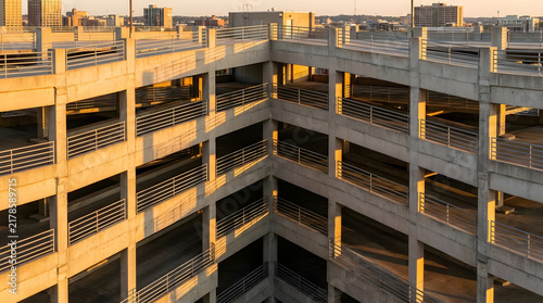 Concrete multi-level parking garage structure at sunset.