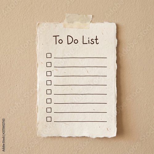 Blank To Do List on textured paper taped to a wall for planning and task management