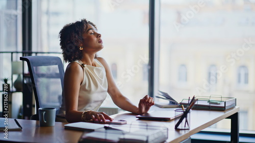 Bild auf Leinwand Businesswoman taking break office desk, relaxing eyes closed then working laptop