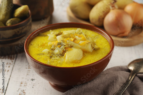 Konstfotografi A bowl with traditional soup in Poland Zupa Ogorkowa