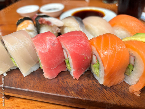 Fotografie Close-up of a variety of fresh sushi rolls and nigiri topped with tuna, salmon,