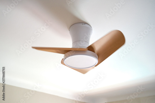 Ceiling fan with light providing air circulation and comfort in a room