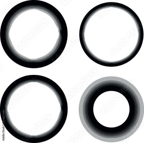 Minimalist set of four black textured ink brush stroke circles with varying thicknesses isolated on a bright white studio backdrop