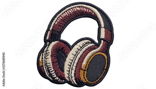Vintage embroidered headphones patch, classic over-ear headphones with chunky retro design, detailed padded ear cups and curved headband, intricate layered thread embroidery, textured woven fabric