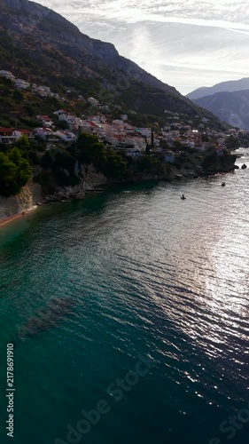Aerial view of Pisak coastal town, Adriatic Sea and mountains at sunrise, Croatia