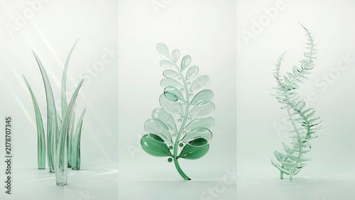 Three glass plant sculptures including grass and ferns on a light white background