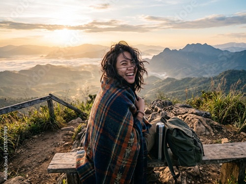 Young Southeast Asian Woman Laughing After Missing Sunrise on Hilltop Viewpoint with Blanket Golden Morning Travel Lifestyle