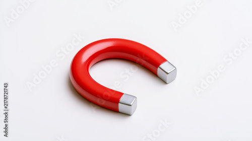 Plakat w ramie Red horseshoe magnet with polished silver tips on a white background with soft shadow