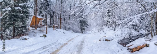 Panel kuchenny z motywem Winter landscape, panorama, banner - view of the gazebo near the snowy road in the winter mountain forest