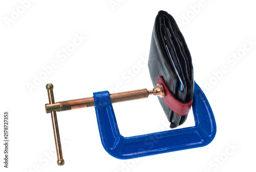 Photography Blue Metal Clamp Squeezing a Leather Wallet