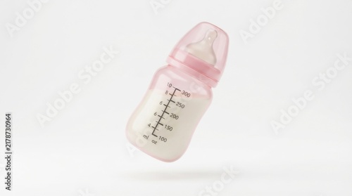 Baby pink plastic feeding bottle with measurement scale isolated on white background for infant care and parenting