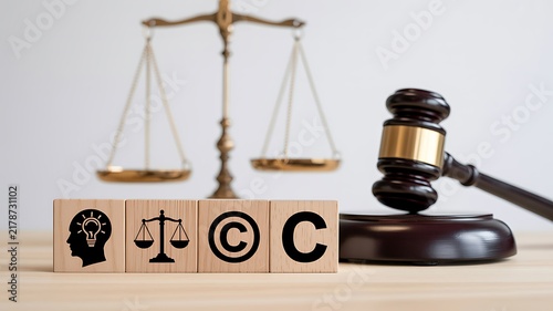 Plakat w ramie Legal compliance concept with scales, gavel, and copyright symbols representing business law and intellectual property
