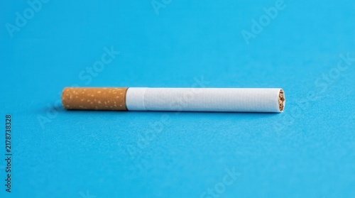 Single Cigarette Against Bold Blue Background Clean Studio Shot