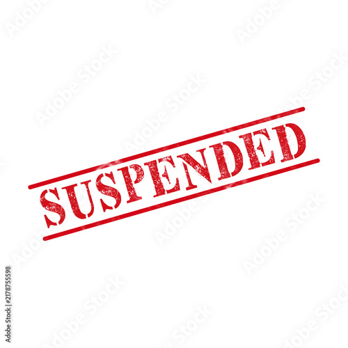 Red ink rubber stamp with the word suspended written in bold capital letters for official document marking