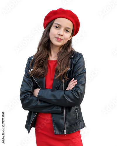 Confident young girl wearing a red beret and black leather jacket with arms crossed red dress child portrait stylish kid fashion portrait smiling child kids fashion red hat white background