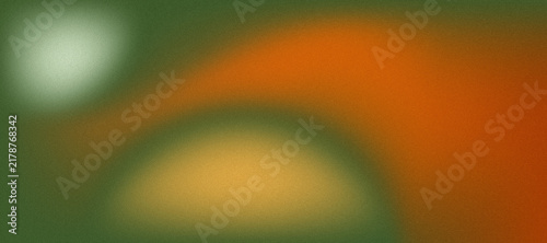 Abstract grainy gradient background with soft blurred light spots in green and orange tones