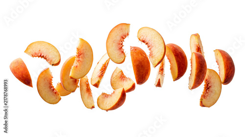 Fresh juicy peach slices floating in mid-air displaying vibrant orange colors and soft textured skin detail on transparent background