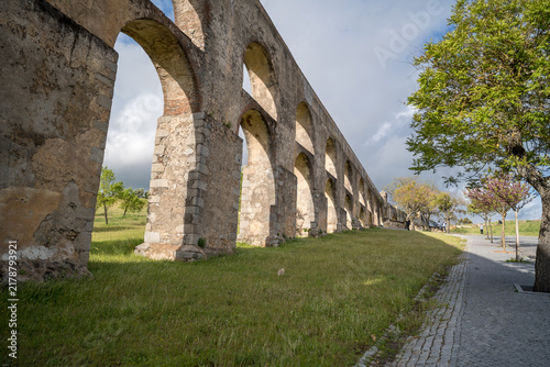 Aqueduct Arches in Elvas Portugal with Green Grass and Trees
