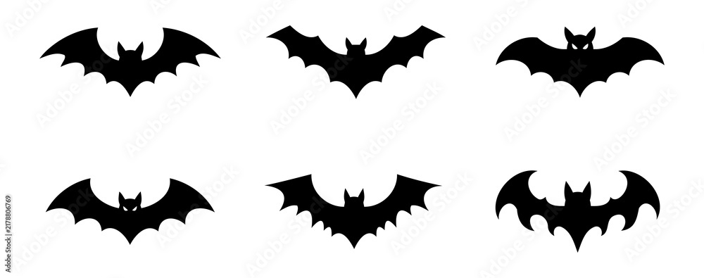 Fototapeta premium Collection of symmetrical flying bat shapes with glowing eyes for spooky party decoration