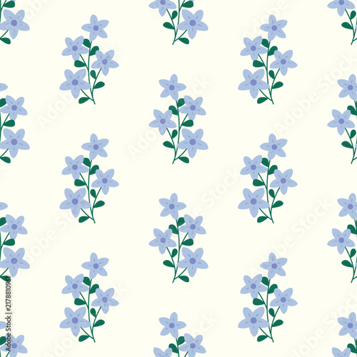 Blue flower bunches forming a seamless pattern on cream background