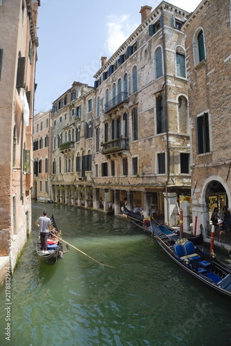 Фотография Gondola ride through the canals of Venice