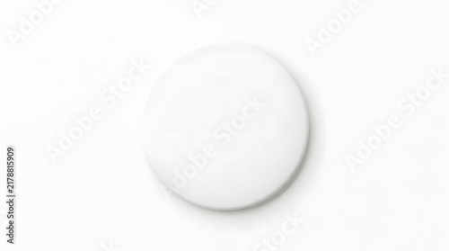 White Pill on White Background: A single white round pill isolated on a stark white background, ready for use or depiction in medical contexts.