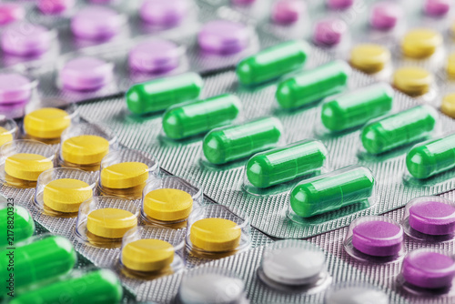 Pills tablets and capsules in blisters for flu treatment. Health care.