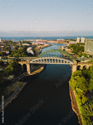 Sunderland UK: 17th July 2026: Sunderland River wear and city centre at dusk. Wearmouth Bridge and the Monkwearmouth Railway Bridge at sunset